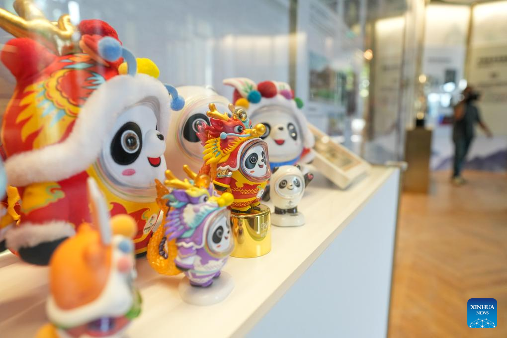 This photo taken on July 24, 2024 shows various editions of Bing Dwen Dwen, the mascots for the Beijing 2022 Olympic Winter Games, at the China House in Paris, France. The China House for the Paris 2024 Olympic Games was inaugurated at the Hotel Salomon de Rothschild in Paris on Wednesday. (Xinhua/Ju Huanzong)