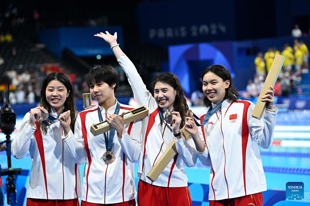 Bronze medalists of team China celebrate during the medal ceremony for Women's 4x100m Freestyle Relay of Swimming at the Paris 2024 Olympic Games in Paris, France, on July 27, 2024. (Xinhua/Wang Peng)