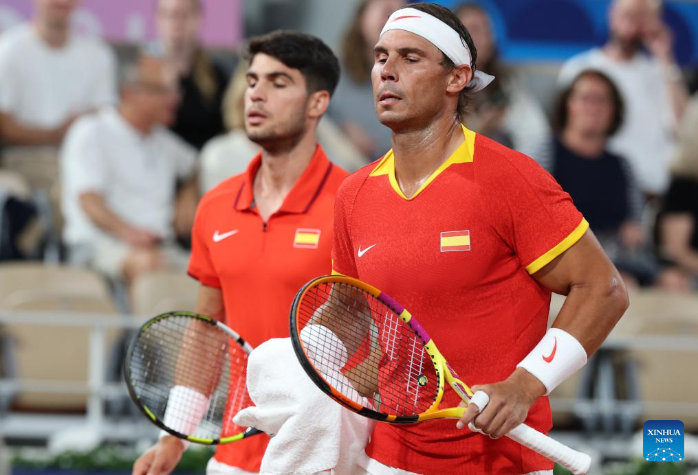 Rafael Nadal/Carlos Alcaraz of Spain compete during the tennis men's doubles first round of Paris 2024 Olympic Games at the Stade Roland-Garros in Paris, France, July 27, 2024. (Xinhua/Gao Jing)