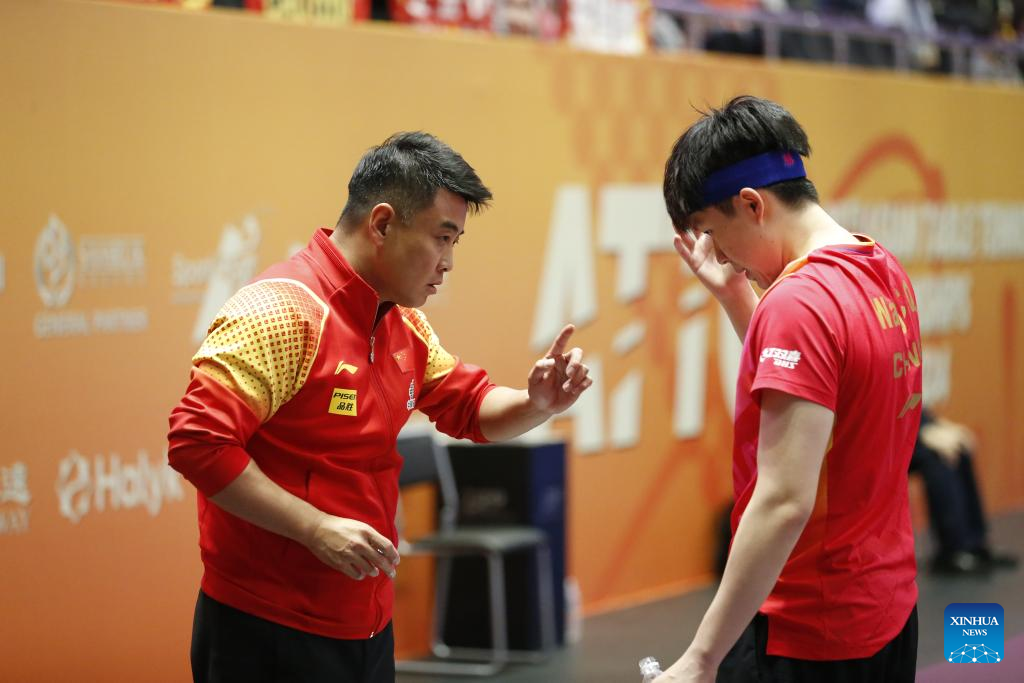 Wang Chuqin (R) of China communicates with coach Wang Hao during the men's singles quarterfinal match against Oh Junsung of South Korea at the 27th ITTF-Asian Table Tennis Championships in Astana, Kazakhstan, Oct. 12, 2024. (Photo by Kalizhan Ospanov/Xinhua)