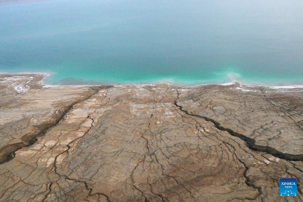 An aerial drone photo taken on March 29, 2025 shows the shoreline of the northern part of the Dead Sea, about 30 kilometers east of Jerusalem. The Dead Sea's declining water level has led to underground salt erosion, causing widespread ground collapse and the formation of sinkholes along the shoreline. (Xinhua)