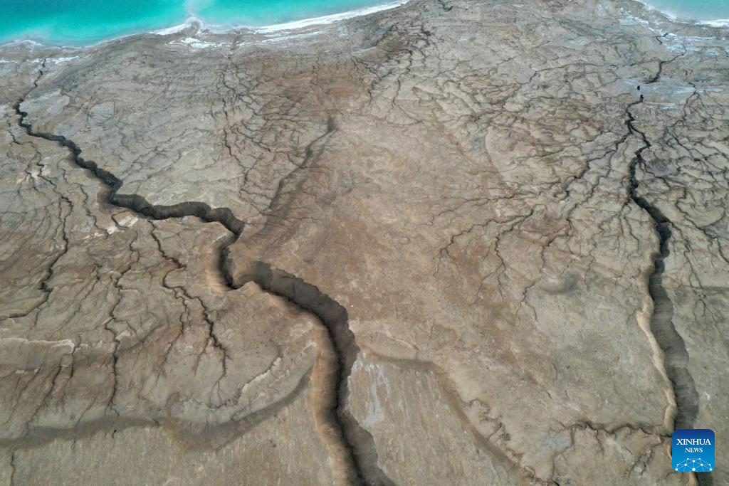 An aerial drone photo taken on March 29, 2025 shows the shoreline of the northern part of the Dead Sea, about 30 kilometers east of Jerusalem. The Dead Sea's declining water level has led to underground salt erosion, causing widespread ground collapse and the formation of sinkholes along the shoreline. (Xinhua)