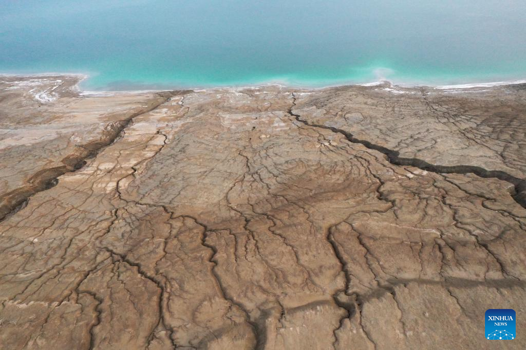 An aerial drone photo taken on March 29, 2025 shows the shoreline of the northern part of the Dead Sea, about 30 kilometers east of Jerusalem. The Dead Sea's declining water level has led to underground salt erosion, causing widespread ground collapse and the formation of sinkholes along the shoreline. (Xinhua)