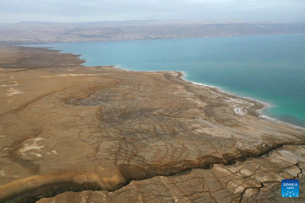 An aerial drone photo taken on March 29, 2025 shows the shoreline of the northern part of the Dead Sea, about 30 kilometers east of Jerusalem. The Dead Sea's declining water level has led to underground salt erosion, causing widespread ground collapse and the formation of sinkholes along the shoreline. (Xinhua)
