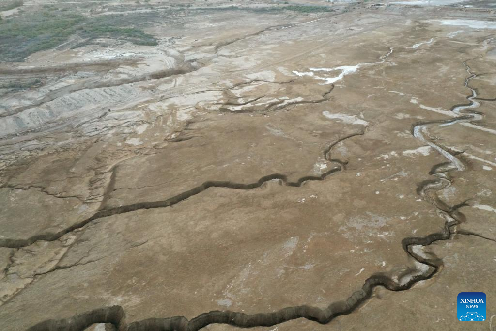 An aerial drone photo taken on March 29, 2025 shows the shoreline of the northern part of the Dead Sea, about 30 kilometers east of Jerusalem. The Dead Sea's declining water level has led to underground salt erosion, causing widespread ground collapse and the formation of sinkholes along the shoreline. (Xinhua)
