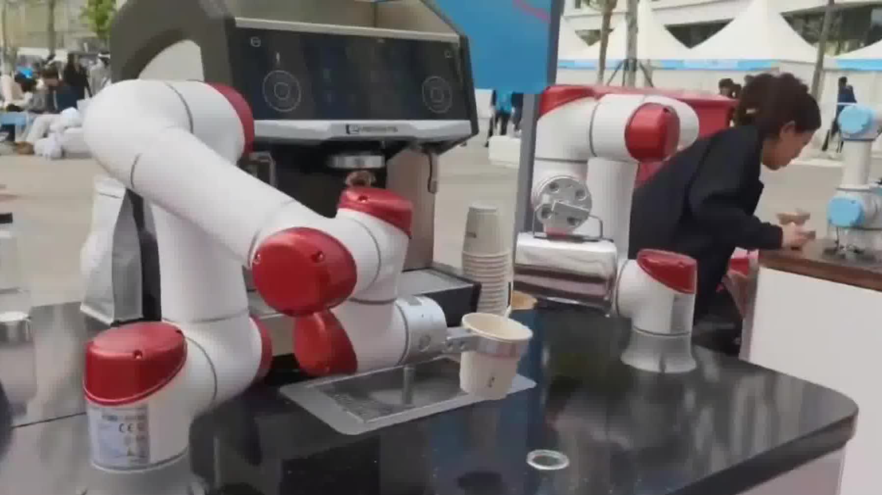 Watch This | Experience future: Coffee-brewing robots, dancing dog-robots, exoskeletons at Beijing ETown half-marathon