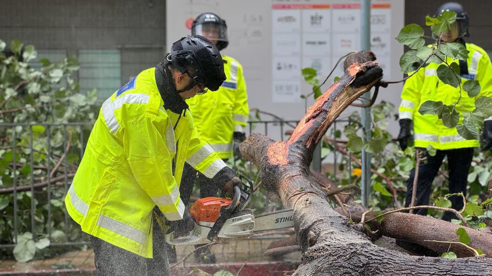 Photos | Typhoon Tapah: Police officers on frontline of wind and rain