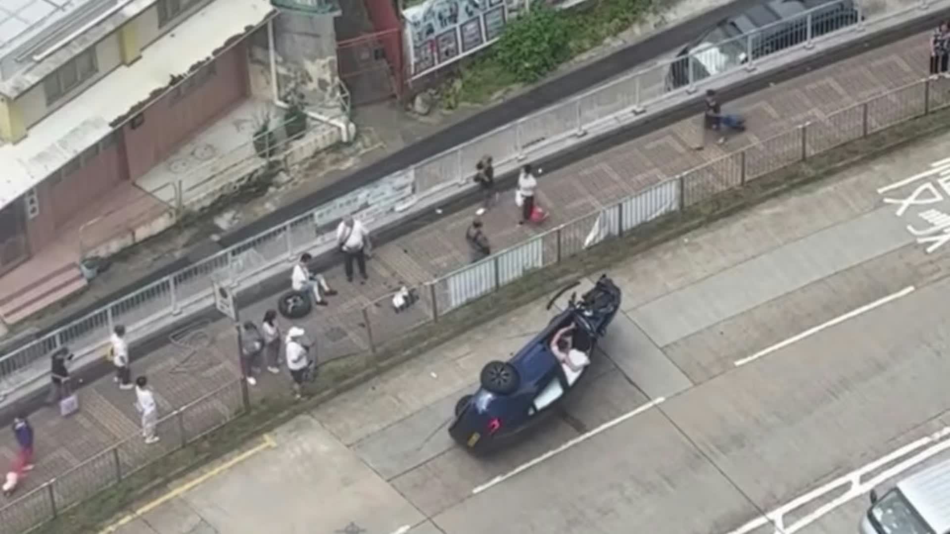 Tai Po Nam Wan Road private car crashes into barrier, overturns: Female bystander injured after being hit