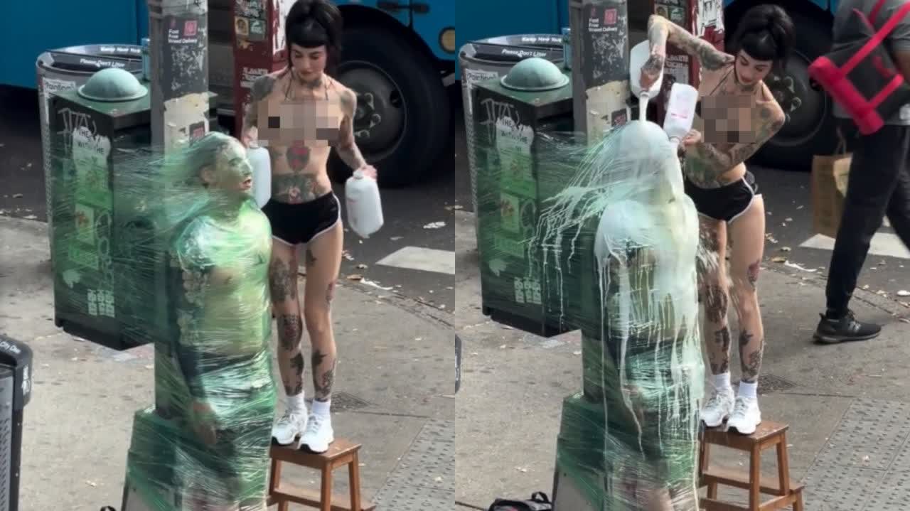Viral New York street performance shows man 'mummified' in plastic wrap and doused with milk in extreme heat