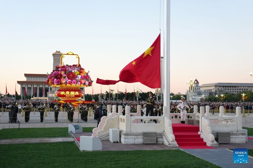 A flag-raising ceremony marking the 77th anniversary of the founding of the People's Republic of China is held at Tian'anmen Square in Beijing, capital of China, Oct. 1, 2026. (Xinhua)
