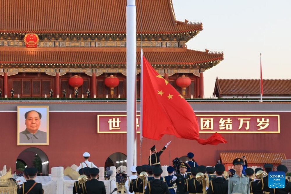 A flag-raising ceremony marking the 77th anniversary of the founding of the People's Republic of China is held at Tian'anmen Square in Beijing, capital of China, Oct. 1, 2026. (Xinhua)