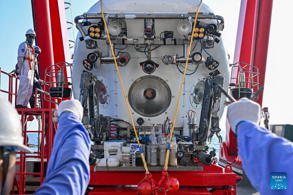 The manned deep-sea submersible Jiaolong is pictured outside its hangar aboard the research vessel Deep Sea No. 1 in the western Pacific Ocean, on Oct. 10, 2026. China's research vessel Deep Sea No. 1, carrying manned deep-sea submersible Jiaolong, arrived at East Caroline Basin in the western Pacific Ocean on Saturday for deep-sea scientific research.
This marks the 466th dive of Jiaolong, with a planned diving depth of about 4,500 meters. (Xinhua)