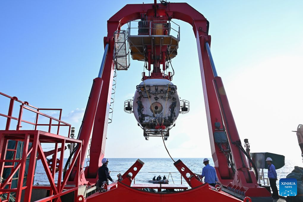The manned deep-sea submersible Jiaolong is pictured outside its hangar aboard the research vessel Deep Sea No. 1 in the western Pacific Ocean, on Oct. 10, 2026. China's research vessel Deep Sea No. 1, carrying manned deep-sea submersible Jiaolong, arrived at East Caroline Basin in the western Pacific Ocean on Saturday for deep-sea scientific research.
This marks the 466th dive of Jiaolong, with a planned diving depth of about 4,500 meters. (Xinhua)