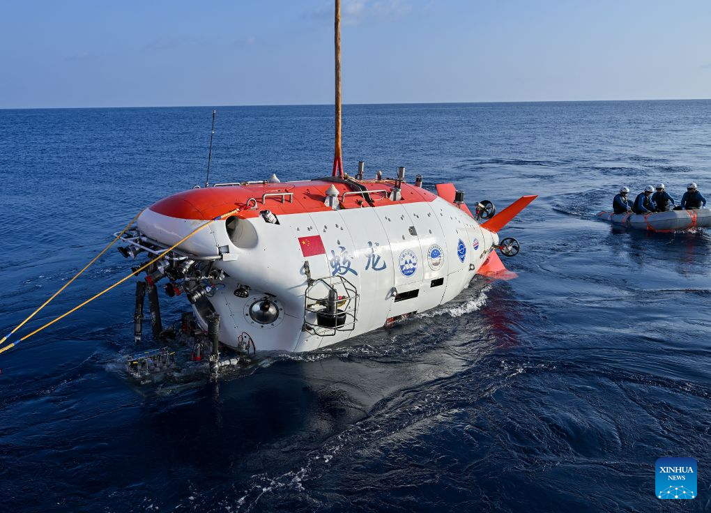 The manned deep-sea submersible Jiaolong is pictured outside its hangar aboard the research vessel Deep Sea No. 1 in the western Pacific Ocean, on Oct. 10, 2026. China's research vessel Deep Sea No. 1, carrying manned deep-sea submersible Jiaolong, arrived at East Caroline Basin in the western Pacific Ocean on Saturday for deep-sea scientific research.
This marks the 466th dive of Jiaolong, with a planned diving depth of about 4,500 meters. (Xinhua)