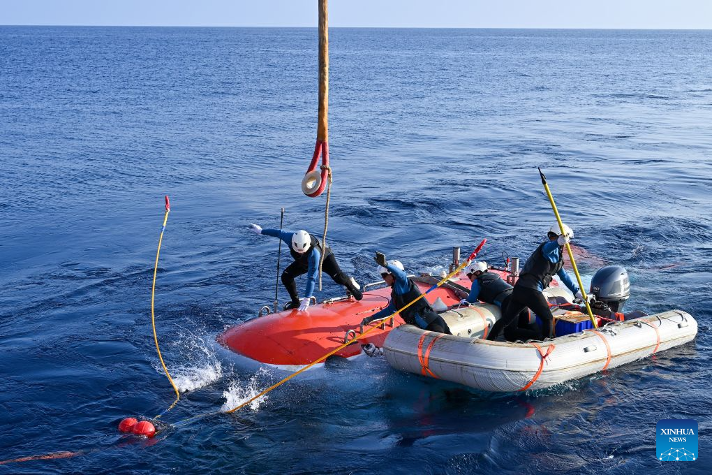 The manned deep-sea submersible Jiaolong is pictured outside its hangar aboard the research vessel Deep Sea No. 1 in the western Pacific Ocean, on Oct. 10, 2026. China's research vessel Deep Sea No. 1, carrying manned deep-sea submersible Jiaolong, arrived at East Caroline Basin in the western Pacific Ocean on Saturday for deep-sea scientific research.
This marks the 466th dive of Jiaolong, with a planned diving depth of about 4,500 meters. (Xinhua)