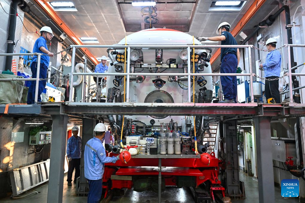 The manned deep-sea submersible Jiaolong is pictured outside its hangar aboard the research vessel Deep Sea No. 1 in the western Pacific Ocean, on Oct. 10, 2026. China's research vessel Deep Sea No. 1, carrying manned deep-sea submersible Jiaolong, arrived at East Caroline Basin in the western Pacific Ocean on Saturday for deep-sea scientific research.
This marks the 466th dive of Jiaolong, with a planned diving depth of about 4,500 meters. (Xinhua)