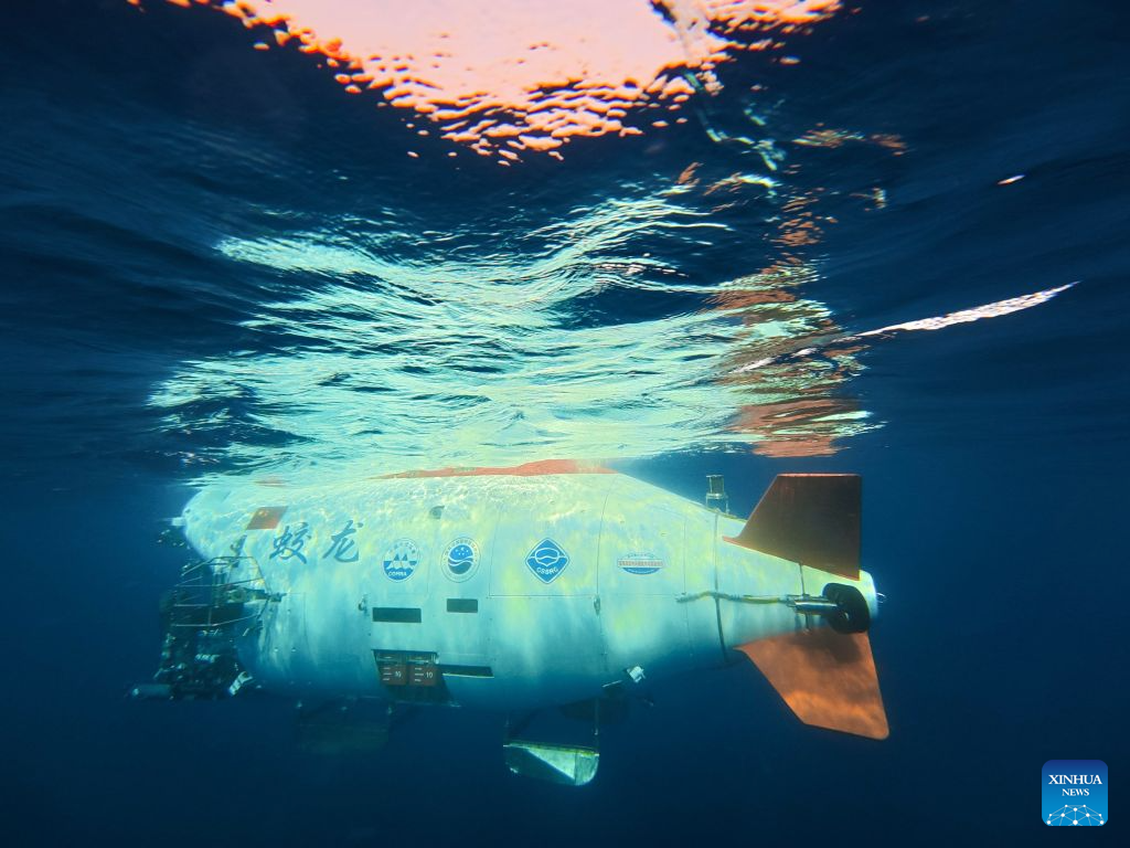 The manned deep-sea submersible Jiaolong is pictured outside its hangar aboard the research vessel Deep Sea No. 1 in the western Pacific Ocean, on Oct. 10, 2026. China's research vessel Deep Sea No. 1, carrying manned deep-sea submersible Jiaolong, arrived at East Caroline Basin in the western Pacific Ocean on Saturday for deep-sea scientific research.
This marks the 466th dive of Jiaolong, with a planned diving depth of about 4,500 meters. (Xinhua)