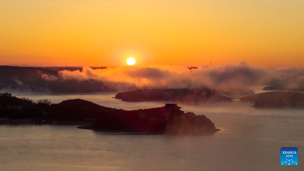 An aerial drone photo taken on Oct. 17, 2026 shows the autumn scenery at sunrise at the Jingpohu Global Geopark in Mudanjiang City, northeast China's Heilongjiang Province. (Wang Baoxun/Xinhua)